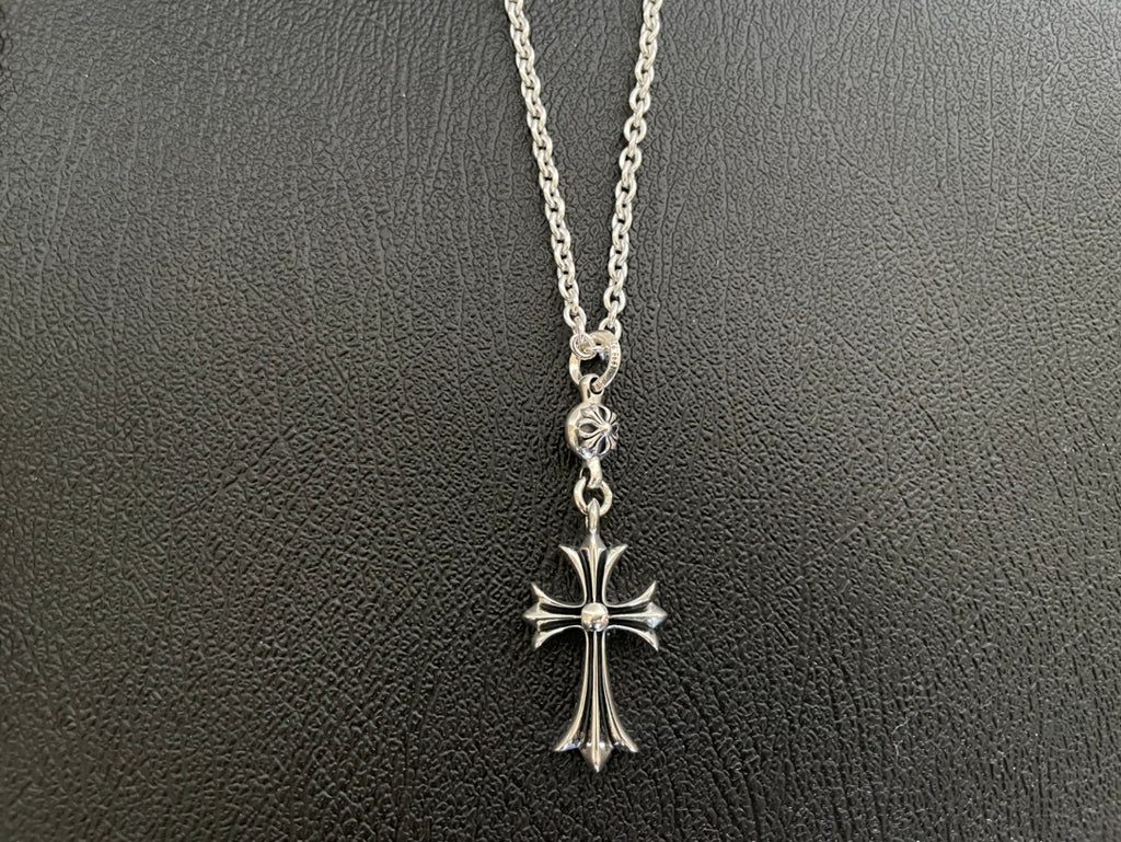 Silver-tone cross pendant necklace with open loop clasp and flared cross arms