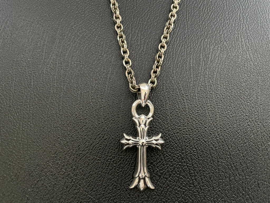 Chrome-tone chain necklace with crown-topped cross pendant