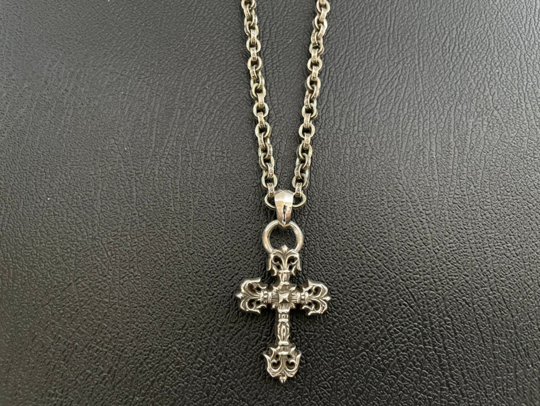 Chrome-tone chain necklace with ornate cross pendant charm