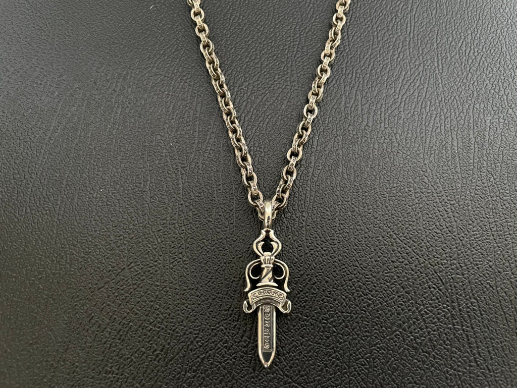 Chrome-tone chain necklace with sword-shaped dagger charm