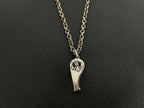 Silver-tone heart-shaped charm necklace with engraved face design on double chain.