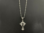 Silver-tone round medallion charm necklace with cross-like hanging pendant on double chain.