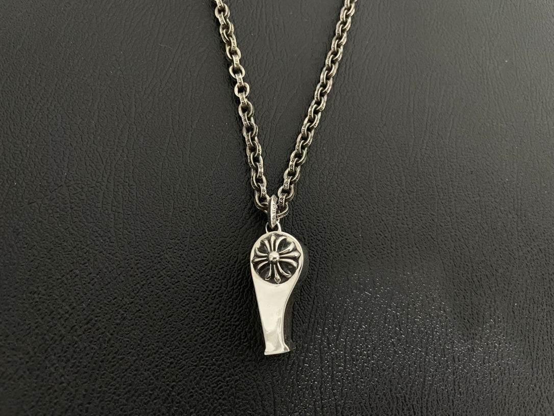 Silver-tone pointed charm necklace with flower star design on double chain.