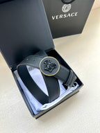 Versace dark blue leather belt laid in box, round Medusa buckle centered
