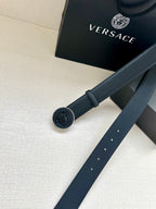 Versace belt with round emblem buckle and dark blue strap detail