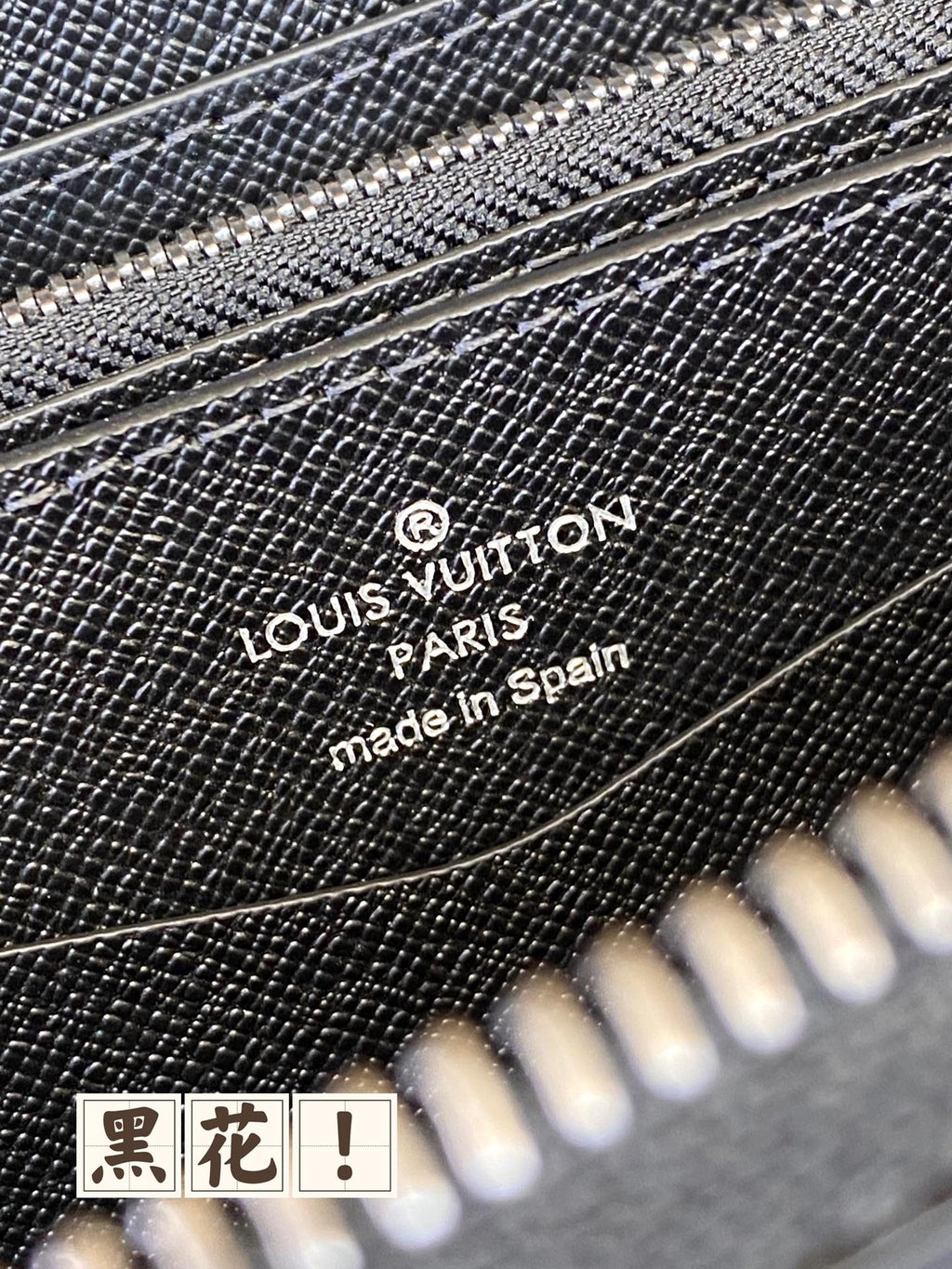 Louis Vuitton Paris made in Spain logo on dark blue wallet surface