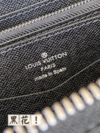 Louis Vuitton Paris made in Spain logo on dark blue wallet surface