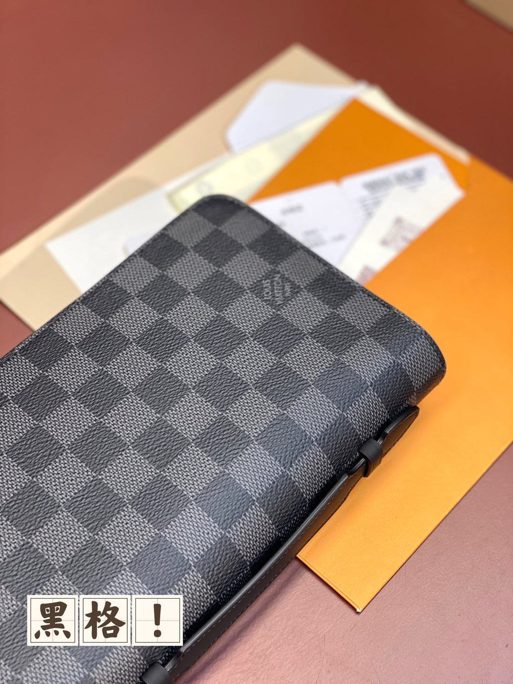 Louis Vuitton small bag, dark gray and navy check cover with zip edge and corner detail