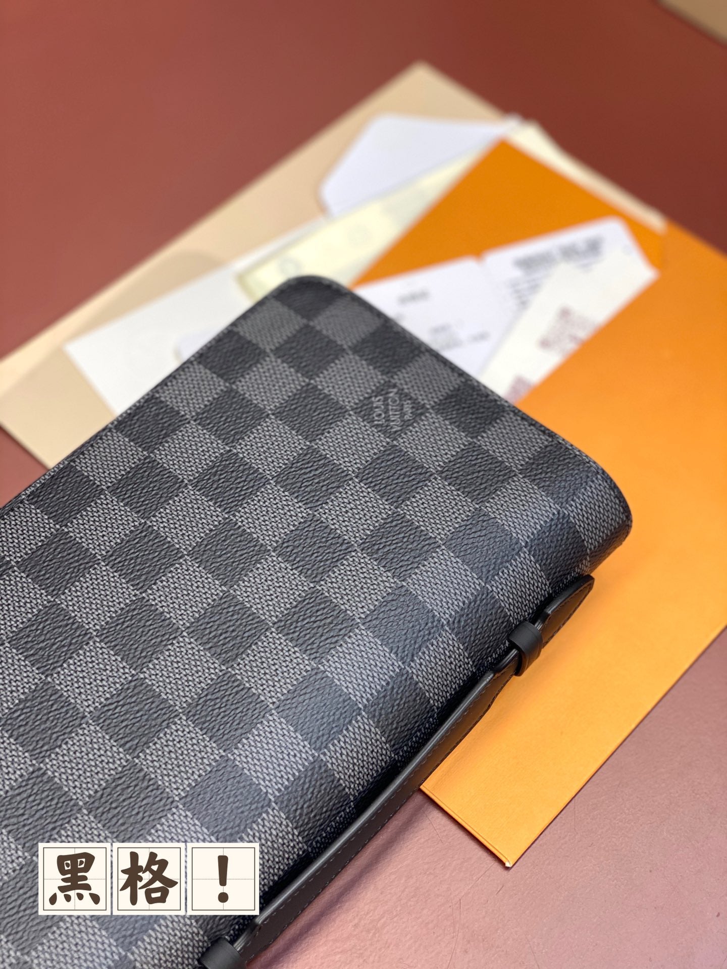 Louis Vuitton small bag, dark gray and navy check cover with zip edge and corner detail