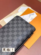 Louis Vuitton checkered zip wallet top view, dark blue-gray leather surface.