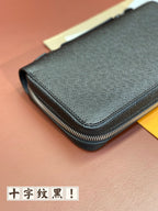 Louis Vuitton blue textured wallet close-up with corner stitching and zipper