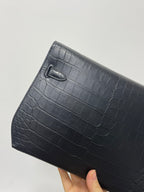 Hermes bag side, croc-textured dark leather, curved top flap with stitched edges