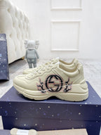 Gucci unisex luxury sneakers, cream lace-up with large GG emblem on side