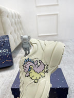 Gucci unisex luxury shoes: cream lace-up sneaker with large unicorn graphic on side