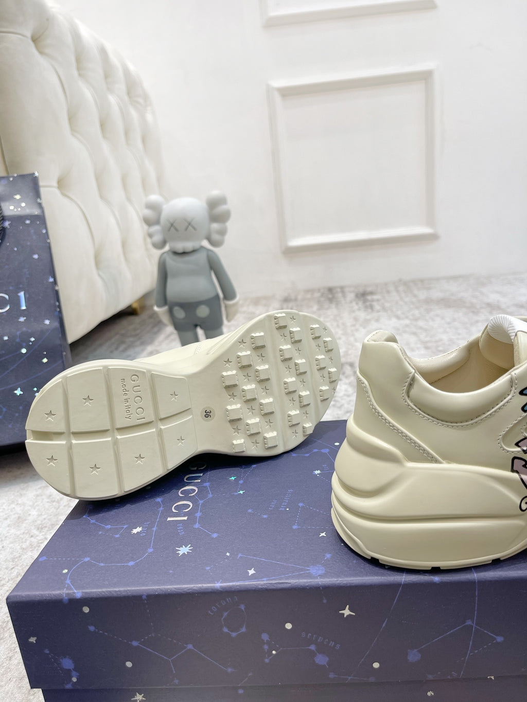 Gucci unisex luxury shoes: cream sneaker with textured sole and logo detail, side