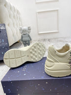 Gucci unisex luxury shoes: cream sneaker with textured sole and logo detail, side