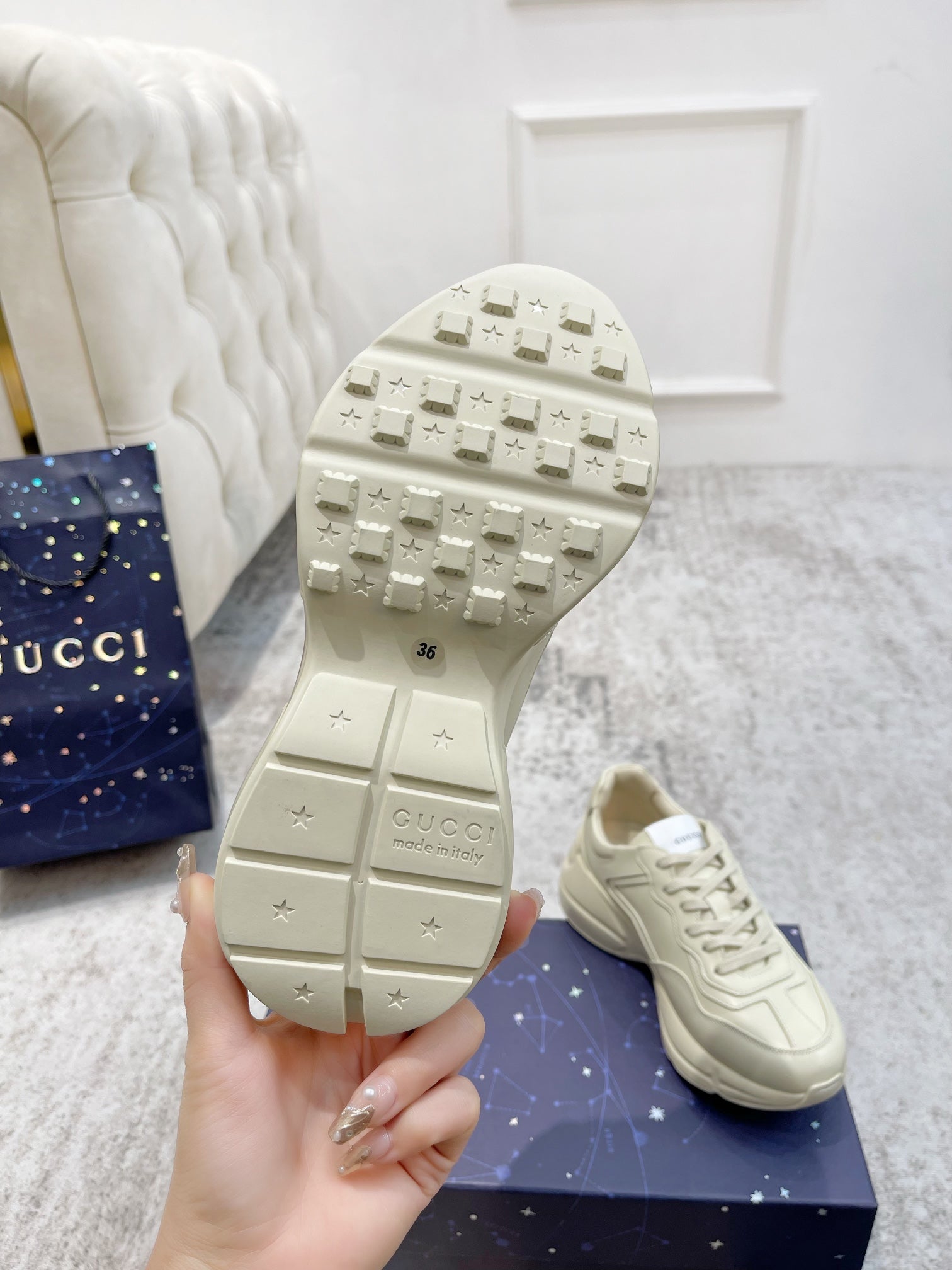 Gucci unisex luxury sneakers, tread sole underside with size marking and Gucci branding