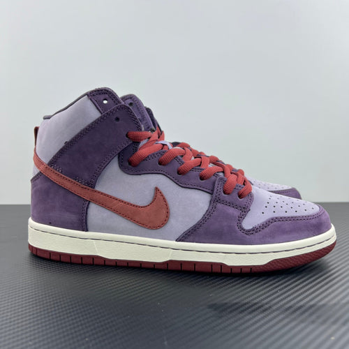 Purple high-top sneaker with white Swoosh, orange accents, orange-red laces, padded collar