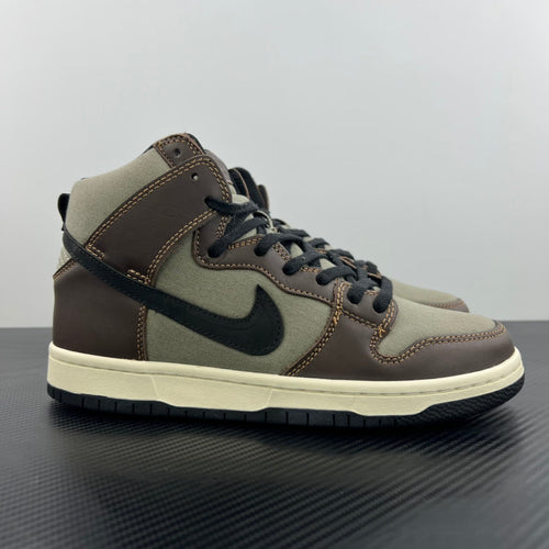High-top sneaker with olive and brown panels, black swoosh, lace-up