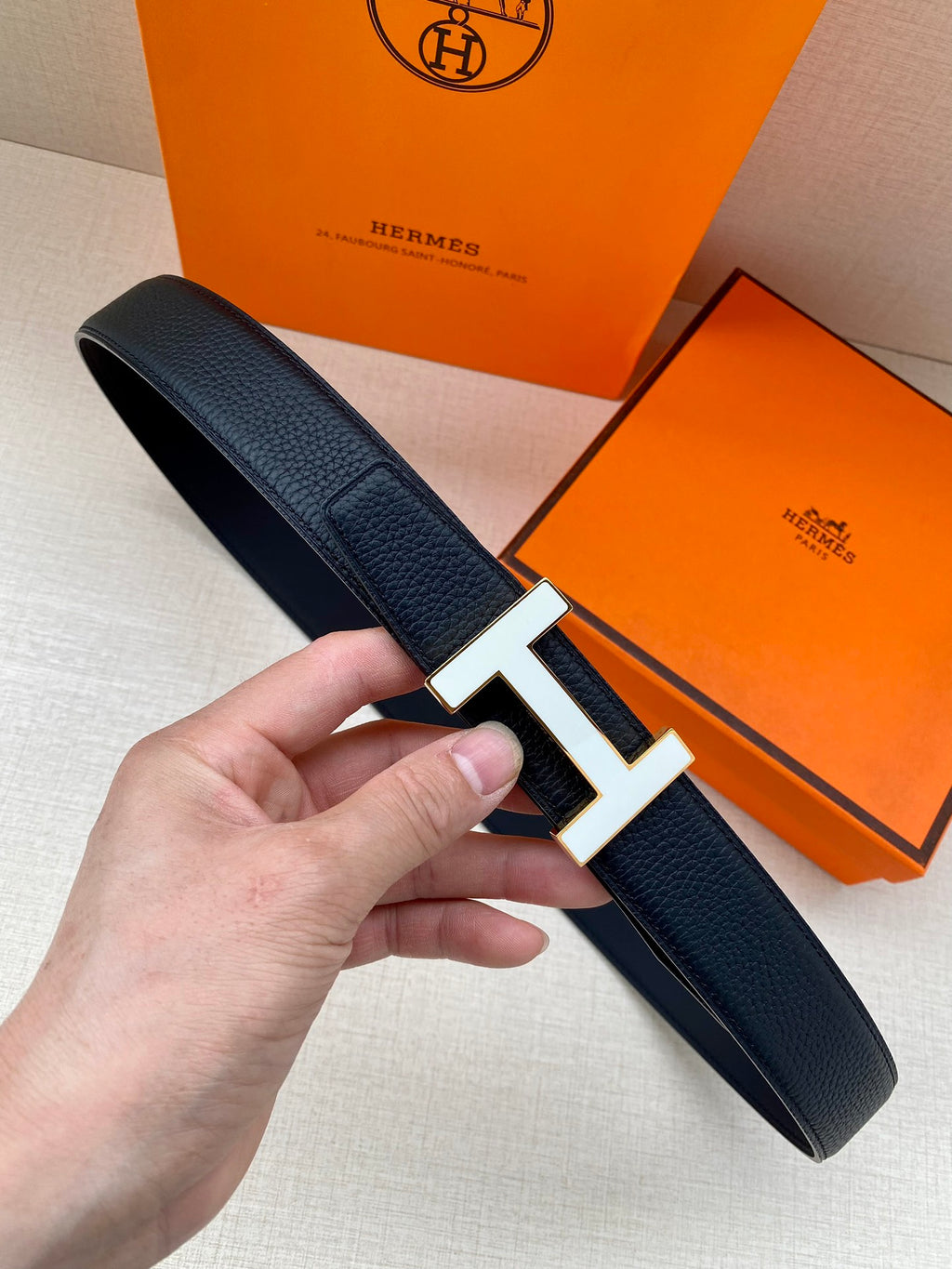 Hermes belt in dark textured leather with silver H buckle and pin closure