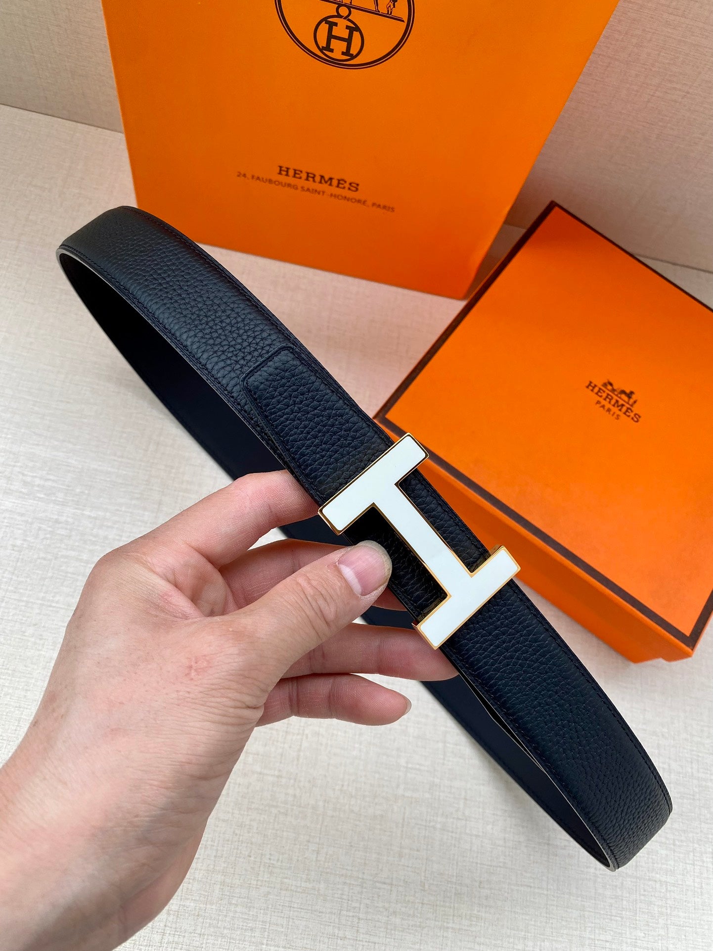 Hermes belt in dark textured leather with silver H buckle and pin closure