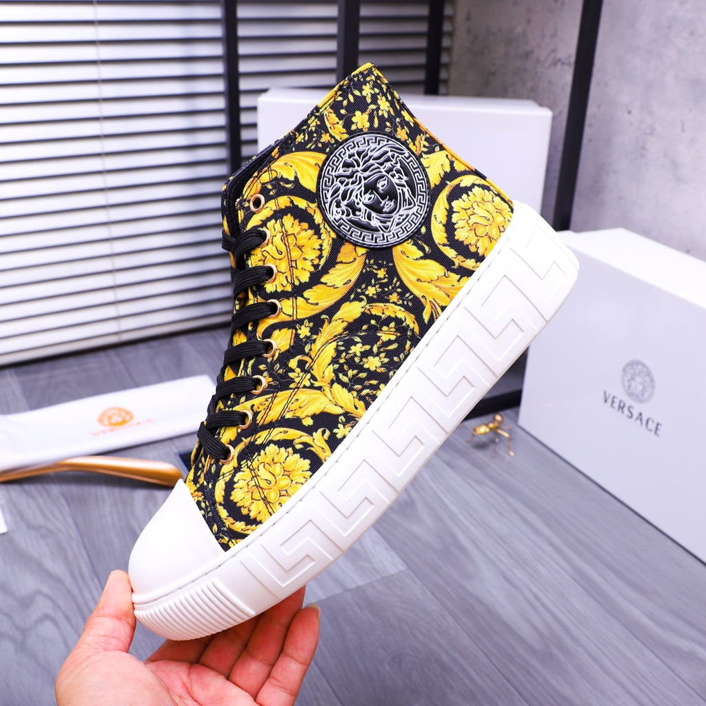 High-top sneakers with yellow floral print, round logo patch, and white sole
