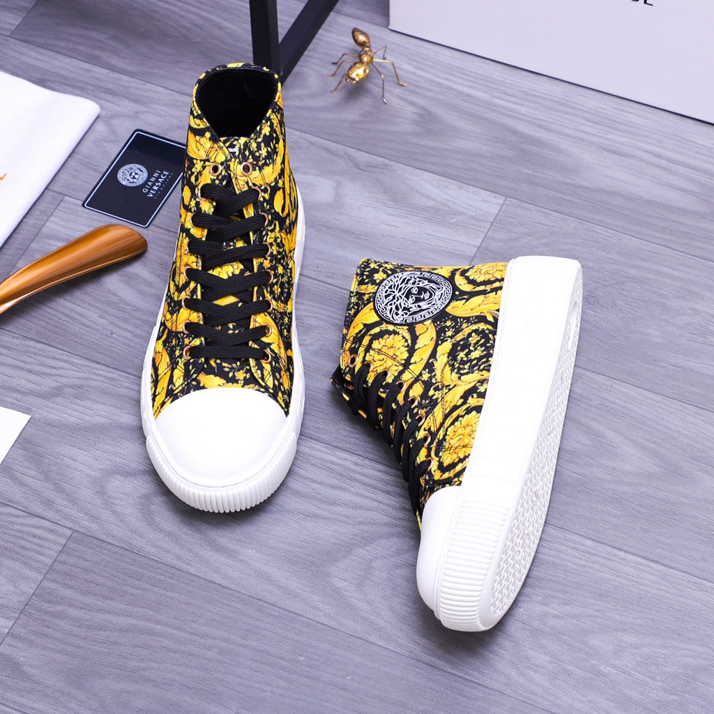 High-top sneakers pair, yellow-and-black floral upper with white midsole and sole