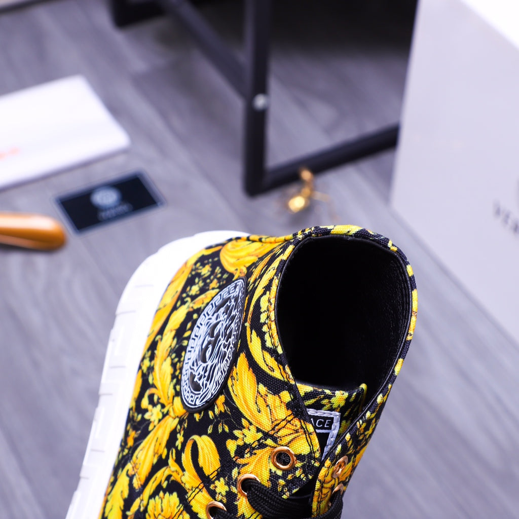 High-top sneakers with yellow floral upper and black interior, side/back view