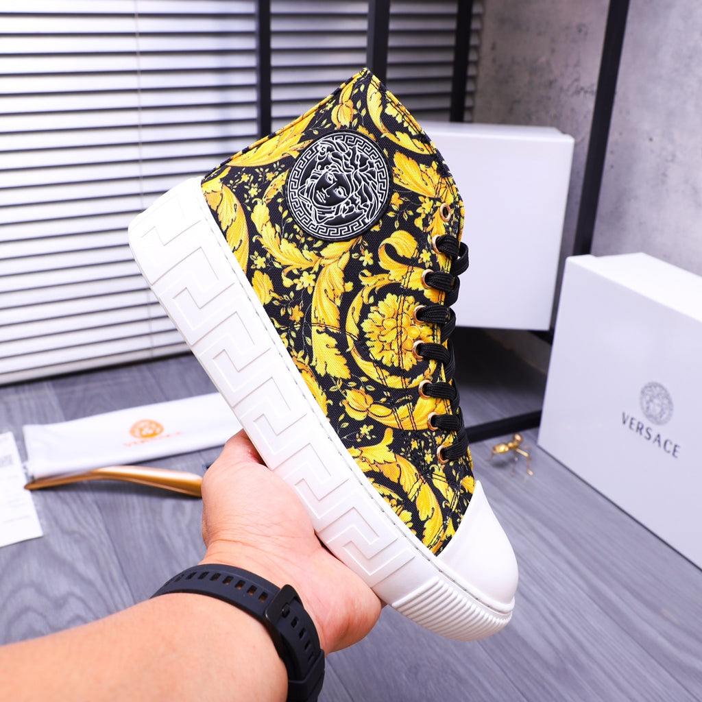 High-top sneakers with yellow floral pattern and round logo patch on the tongue