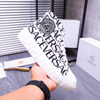 Versace high-top sneakers, white with black allover lettering and circular crest patch