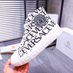 Versace high-top sneakers, white with black lettering and Medusa-style crest at ankle