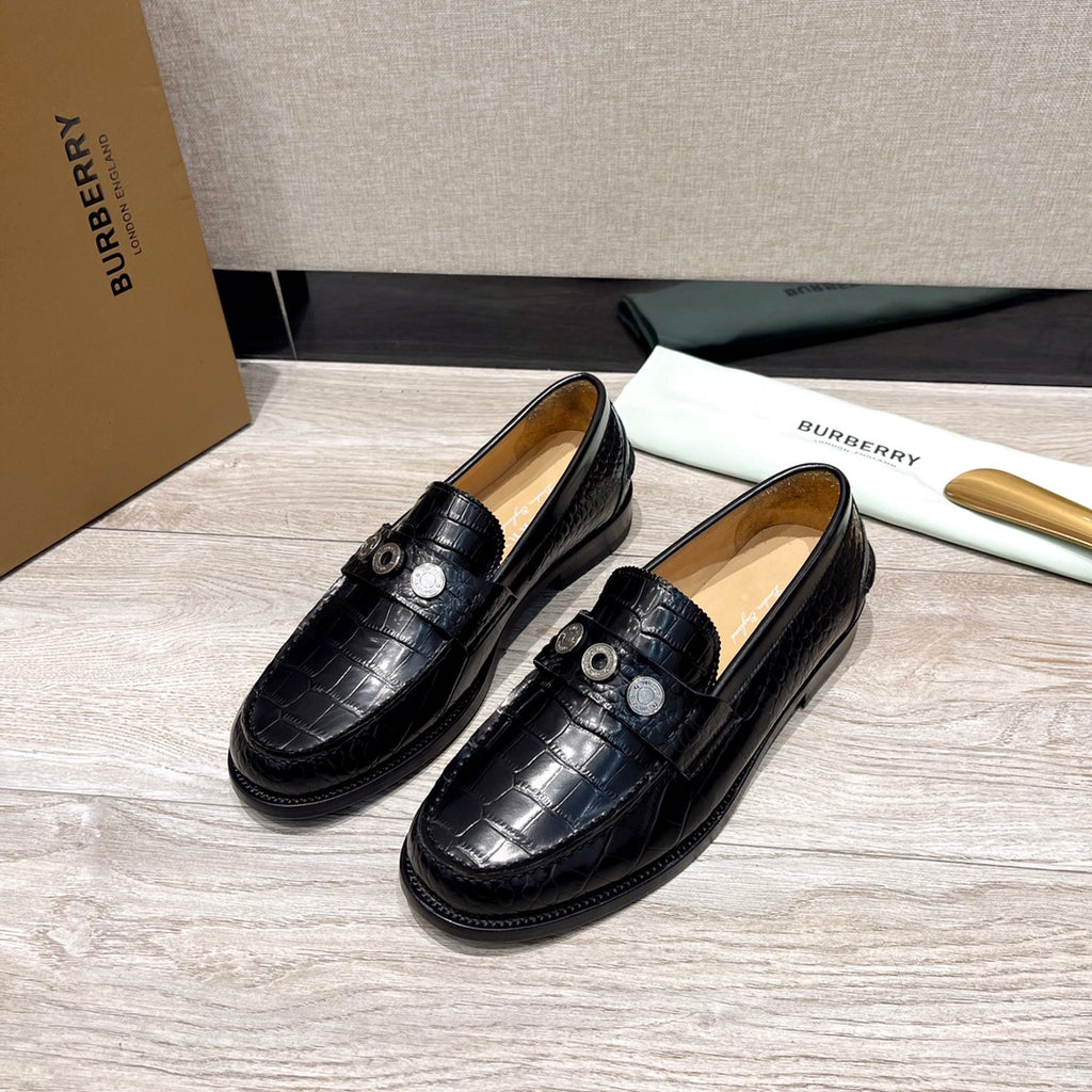 Burberry luxury loafers in black embossed leather, round metal stud detail