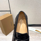 Burberry luxury loafers, black embossed leather upper with tan insole