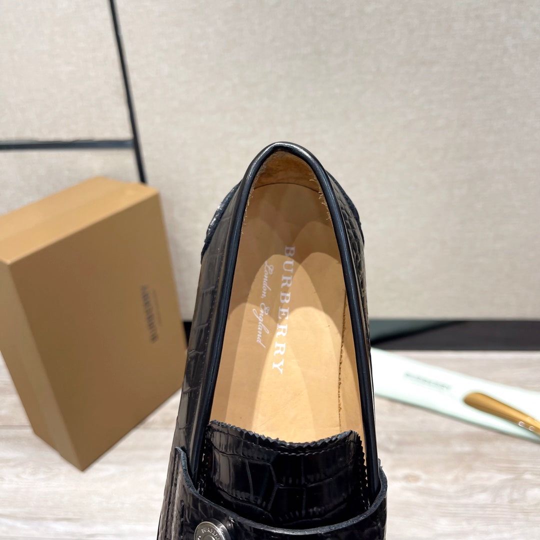 Burberry luxury loafers, black embossed leather upper with tan insole
