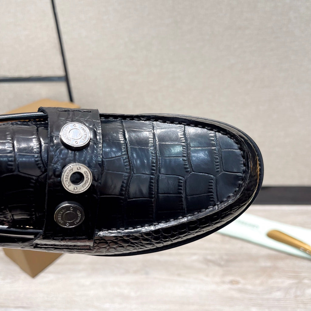 Burberry luxury loafers, black embossed leather vamp with metal stud closure