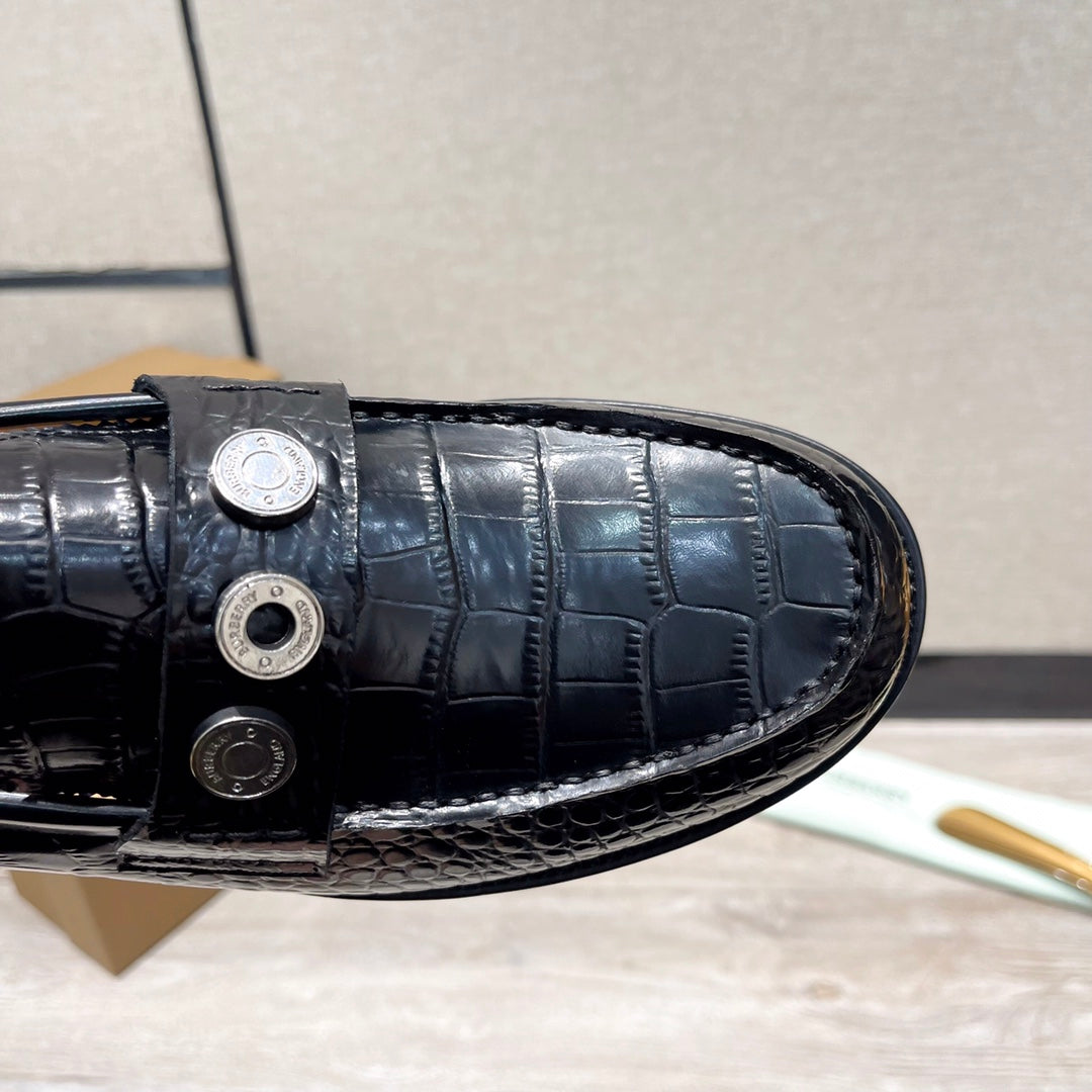 Burberry luxury loafers, black embossed leather vamp with metal stud closure