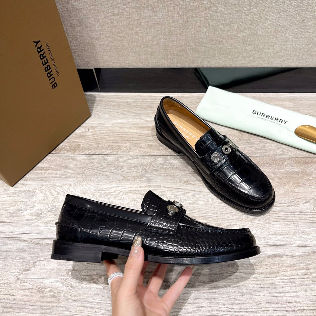 Burberry luxury loafers, black embossed leather, low-profile sole and vamp hardware