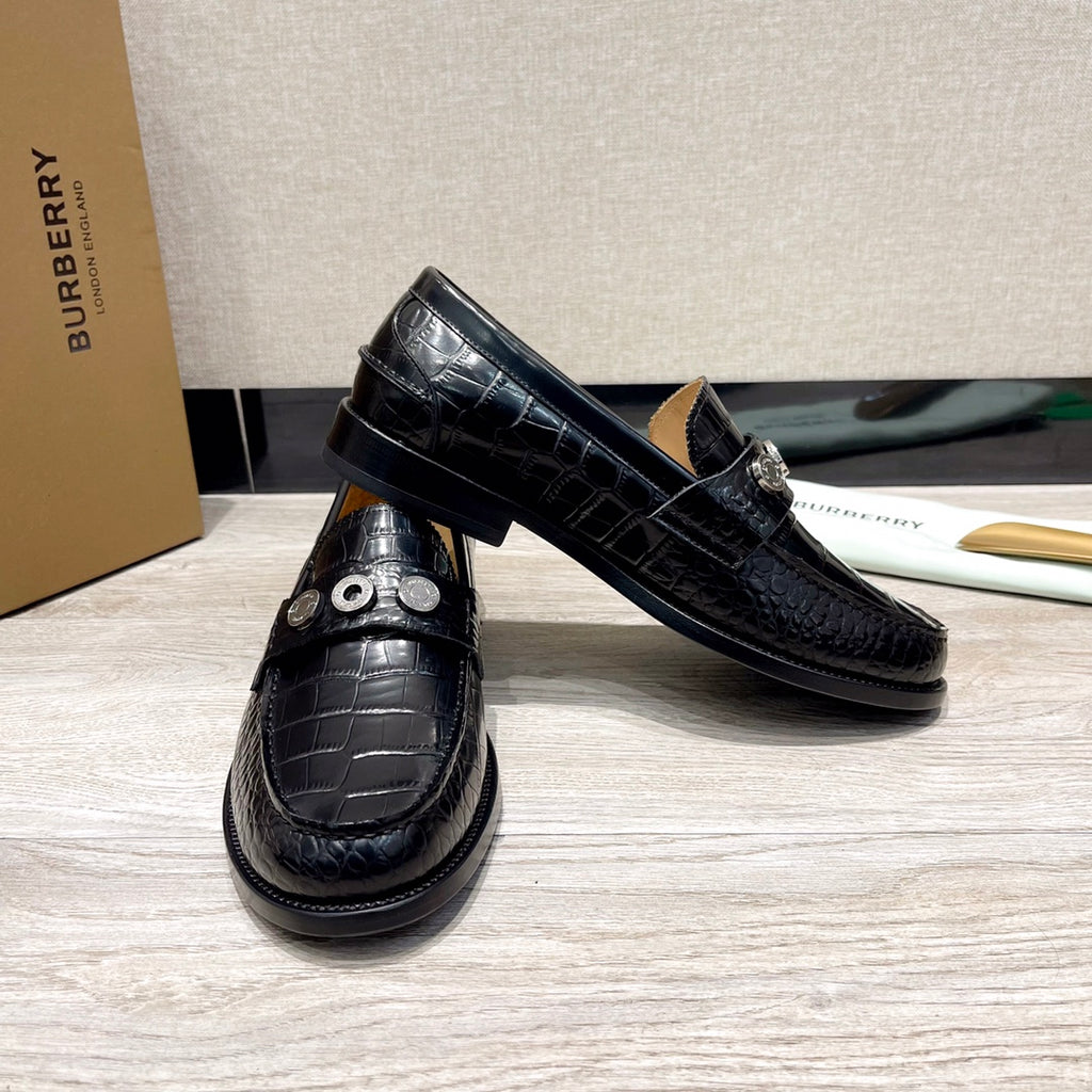 Burberry luxury loafers, black embossed leather with strap-style vamp and metal studs