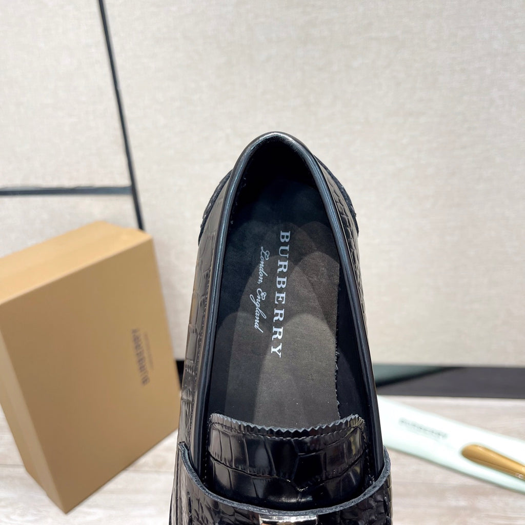 Black leather loafer interior with embossed upper and stitched edge