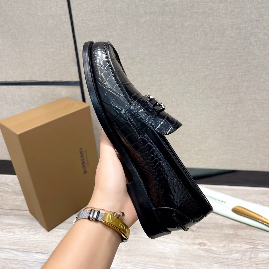 Black embossed leather loafer with metal buckle strap