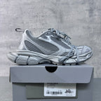 Balenciaga lace-up sneakers with light gray-blue mesh panels, shown on box