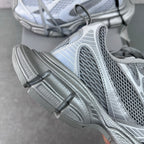 Balenciaga sneaker close-up: side mesh panel, striped trim, thick molded sole