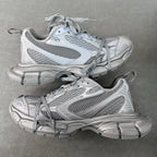 Balenciaga mesh sneakers with light gray-blue uppers, lace-up, chunky rubber sole