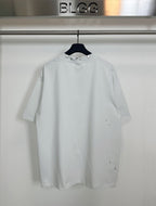 Balenciaga white short-sleeve T-shirt with small distressed spots on chest