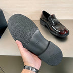 Prada unisex loafer outsole shown, black textured sole with brand mark