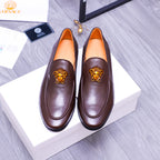 Brown leather slip-on loafers with gold Medusa emblem