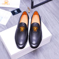 Versace black leather loafers with gold Medusa emblem and orange interior lining