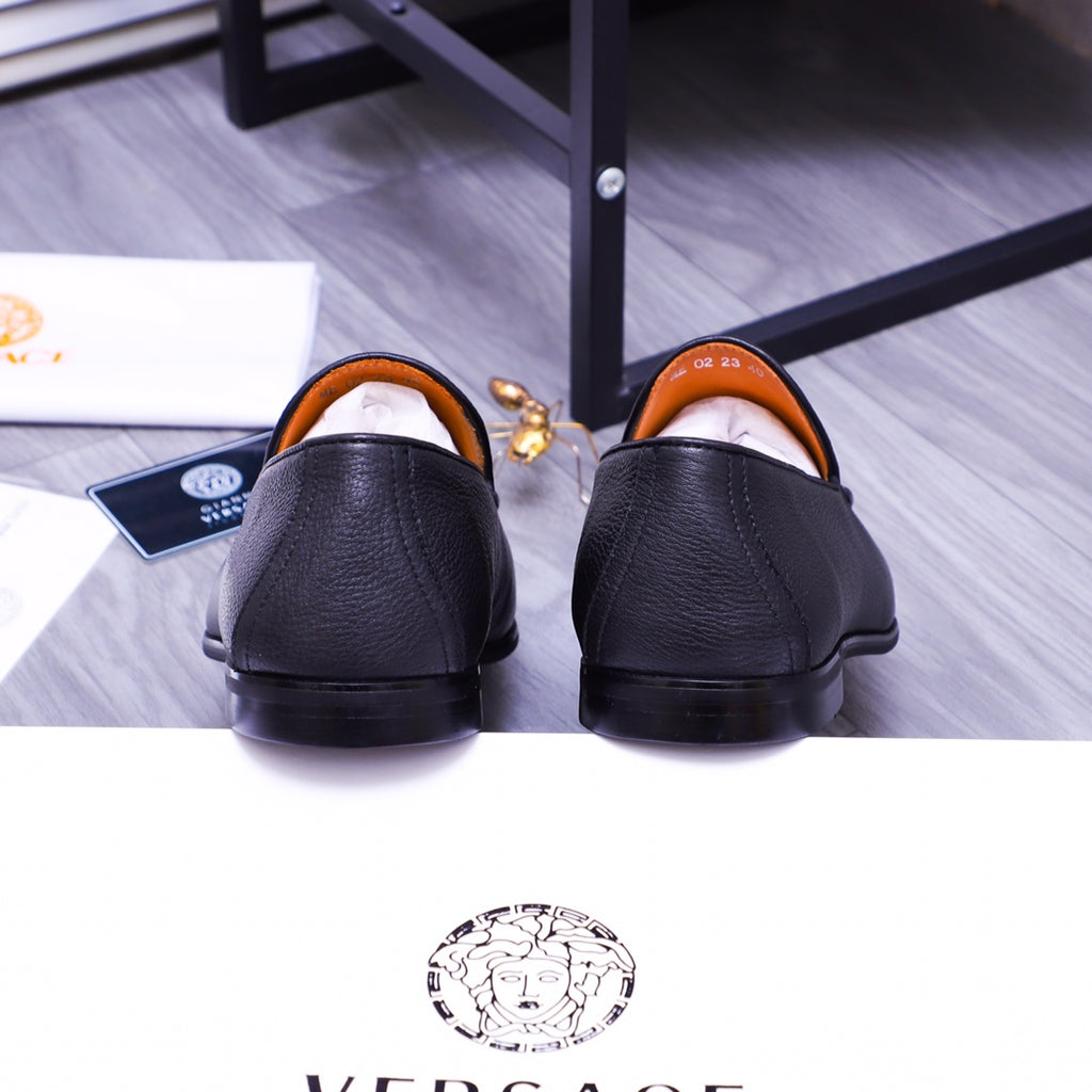 Versace black leather loafers with orange lining, back view