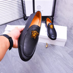 Versace black leather loafers with gold Medusa emblem and orange lining, slip-on
