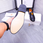 Versace black leather loafer sole and orange interior lining, outsole view